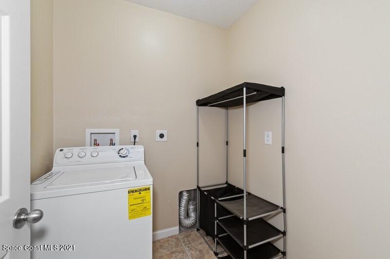 Undisclosed Address Melbourne, FL 32935 - Photo 13 of 17 12_2725RevolutionSt_101_44_LaundryRoom_F