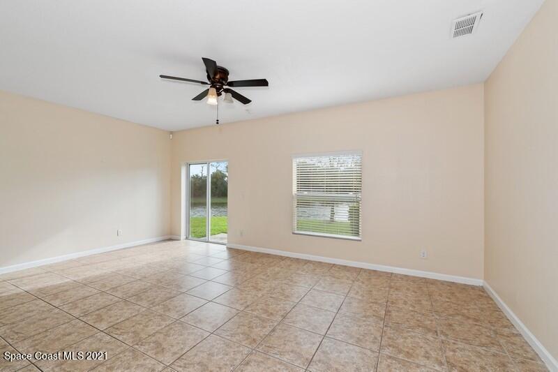Undisclosed Address Melbourne, FL 32935 - Photo 5 of 17 04_2725RevolutionSt_101_3_FamilyRoom_Fle