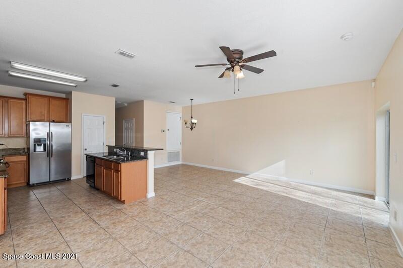 Undisclosed Address Melbourne, FL 32935 - Photo 6 of 17 06_2725RevolutionSt_101_94_FamilyRoomKit