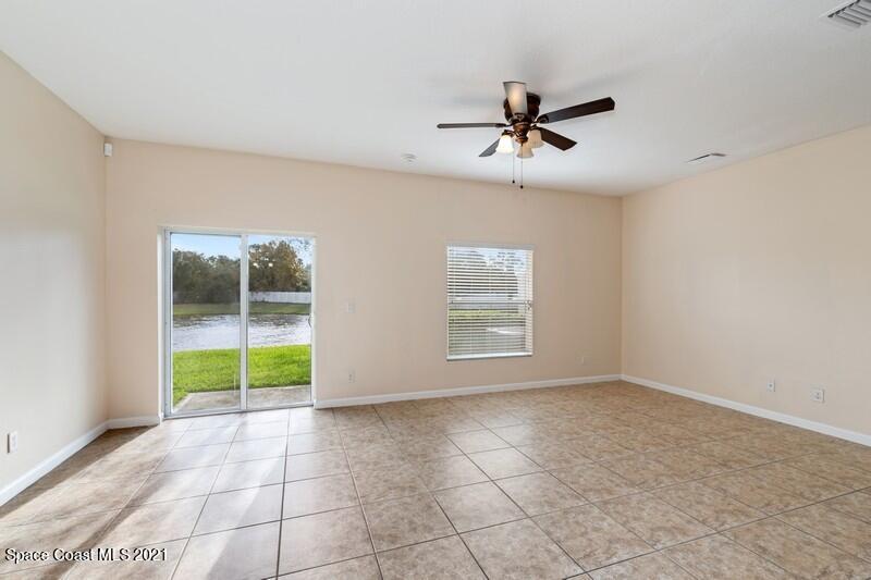 Undisclosed Address Melbourne, FL 32935 - Photo 7 of 17 05_2725RevolutionSt_101_3001_FamilyRoom_