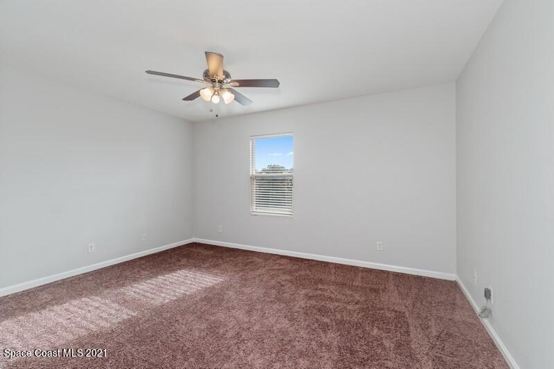 Undisclosed Address Melbourne, FL 32935 - Photo 8 of 17 08_2725RevolutionSt_101_14_PrimaryBedroo