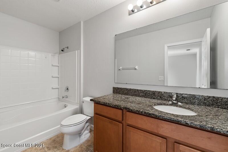 Undisclosed Address Melbourne, FL 32935 - Photo 9 of 17 09_2725RevolutionSt_101_13_PrimaryBathro