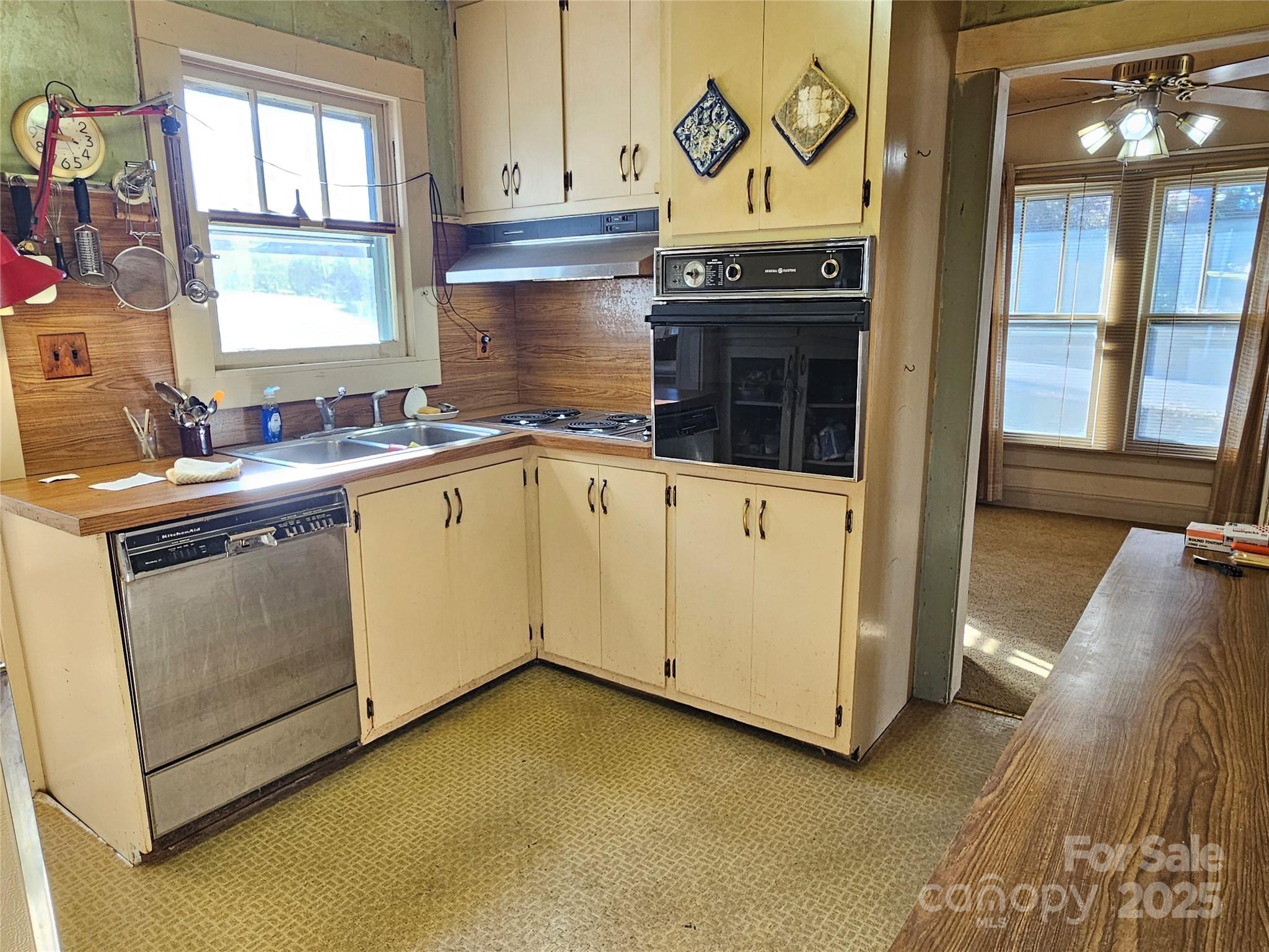 101 Edgewood Avenue Morganton, NC 28655 - Photo 17 of 32 a kitchen with a sink stove and cabinets