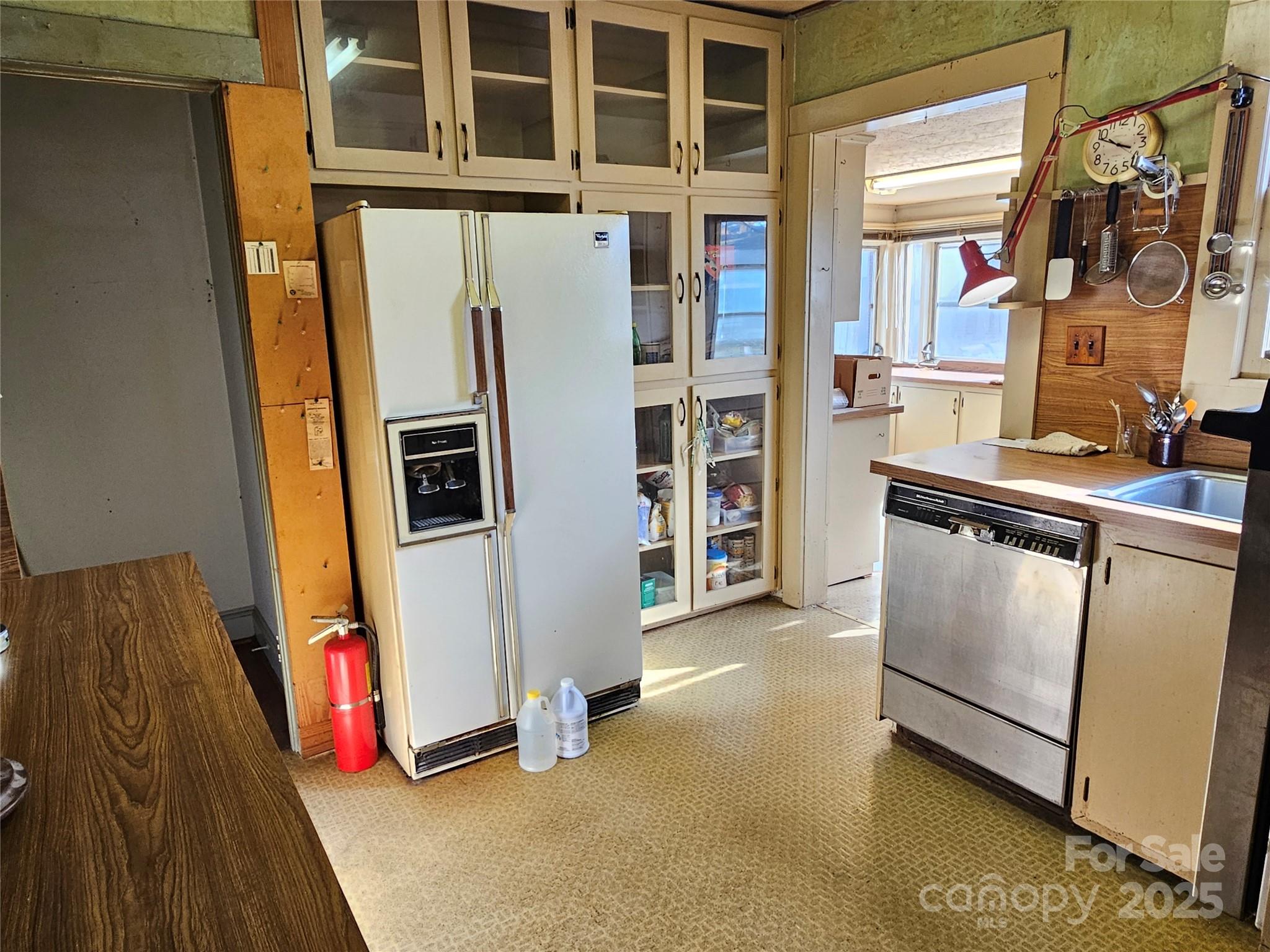 101 Edgewood Avenue Morganton, NC 28655 - Photo 18 of 32 a view of a kitchen with fridge and entryway