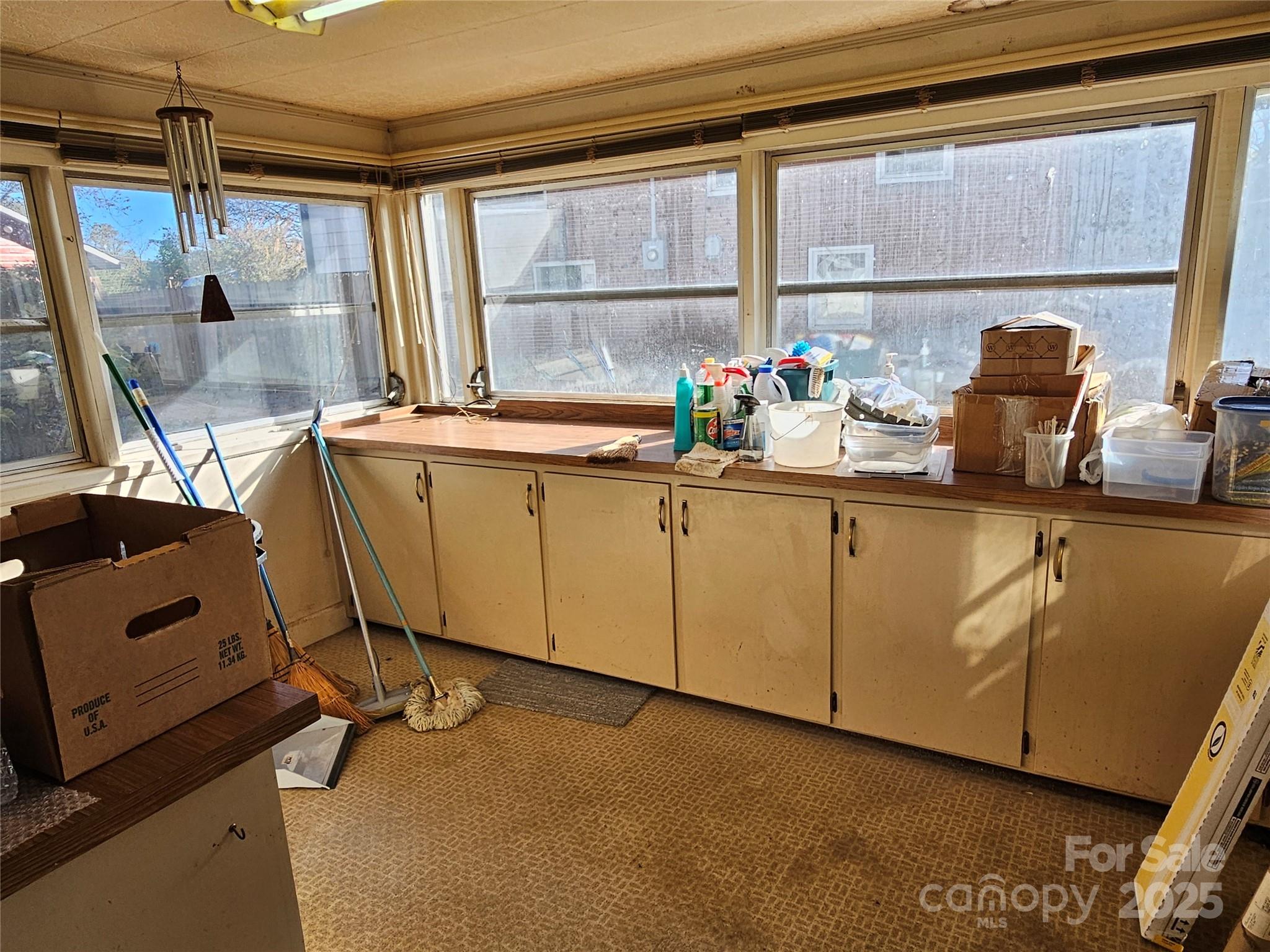 101 Edgewood Avenue Morganton, NC 28655 - Photo 19 of 32 a kitchen with a sink cabinets and window