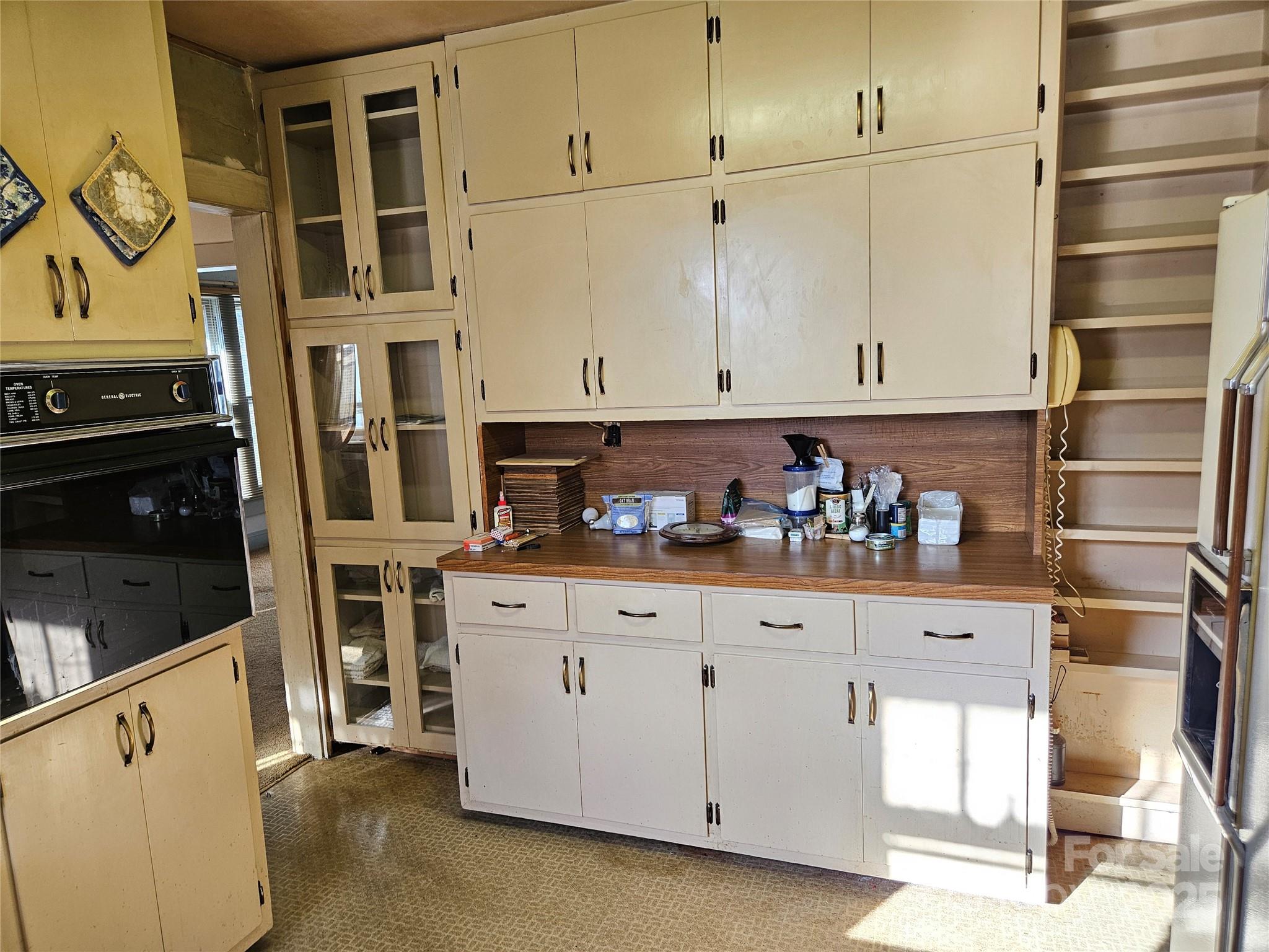 101 Edgewood Avenue Morganton, NC 28655 - Photo 20 of 32 a kitchen with stainless steel appliances cabinets and a window