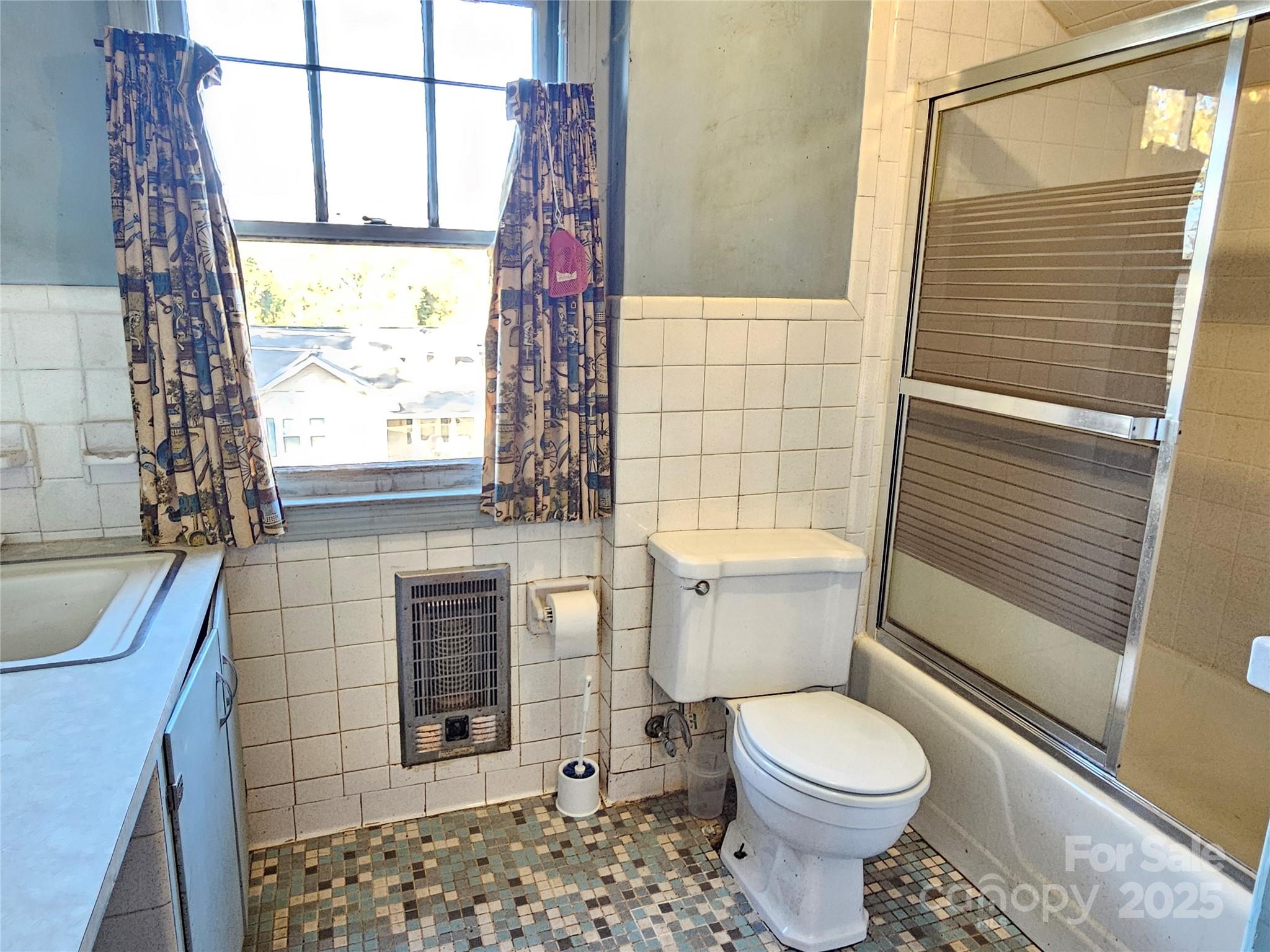 101 Edgewood Avenue Morganton, NC 28655 - Photo 23 of 32 a bathroom with a toilet and a shower