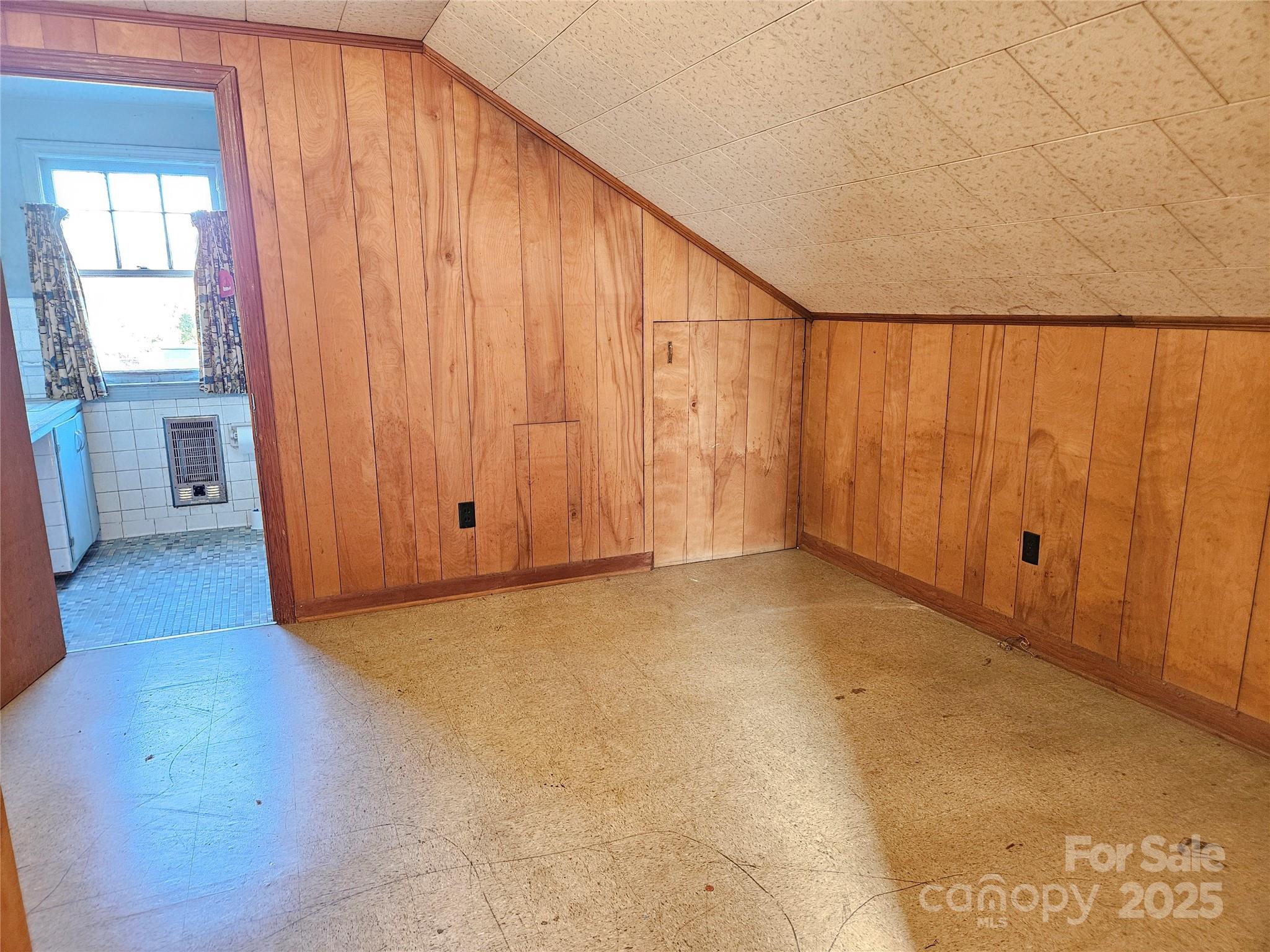 101 Edgewood Avenue Morganton, NC 28655 - Photo 25 of 32 a view of an empty room with wooden floor and entryway