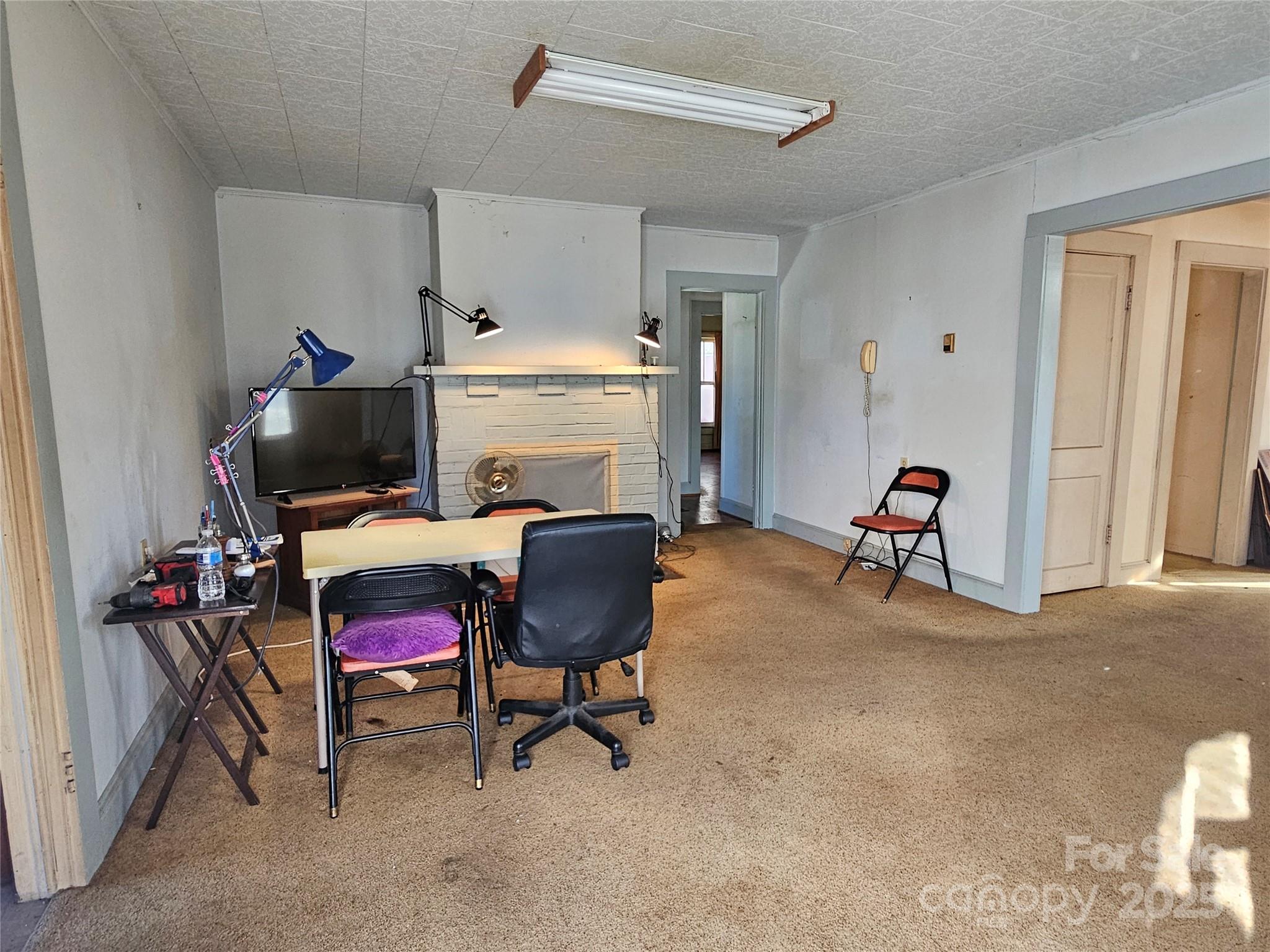 101 Edgewood Avenue Morganton, NC 28655 - Photo 9 of 32 a room with furniture a flat screen tv and a window