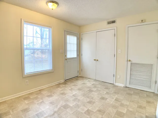 an empty room with windows