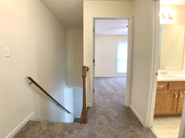 a view of a hallway with front door