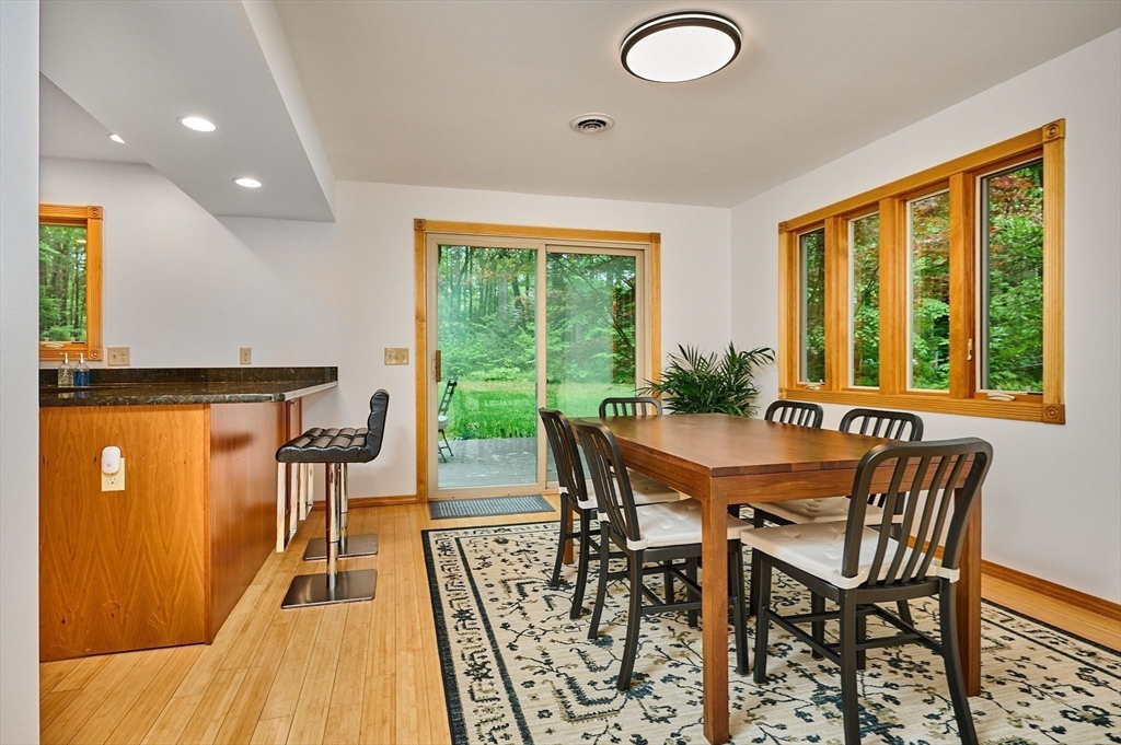 88 High Point Drive Amherst, MA 01002 - Photo 14 of 35 a view of a dining room with furniture and wooden floor