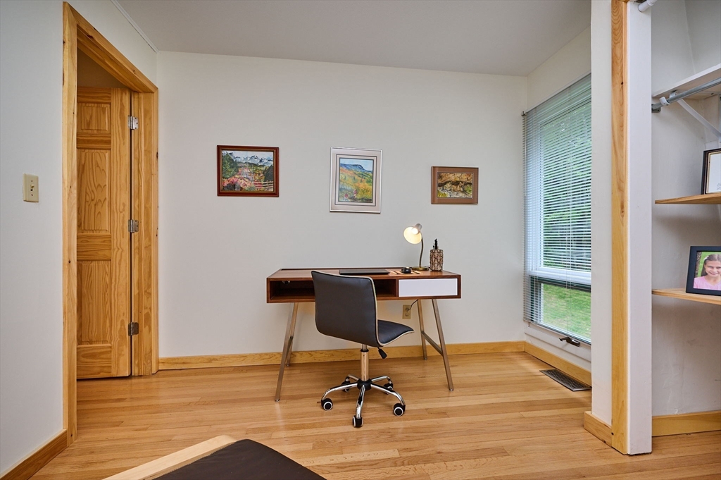 88 High Point Drive Amherst, MA 01002 - Photo 22 of 35 a workspace with furniture and wooden floor