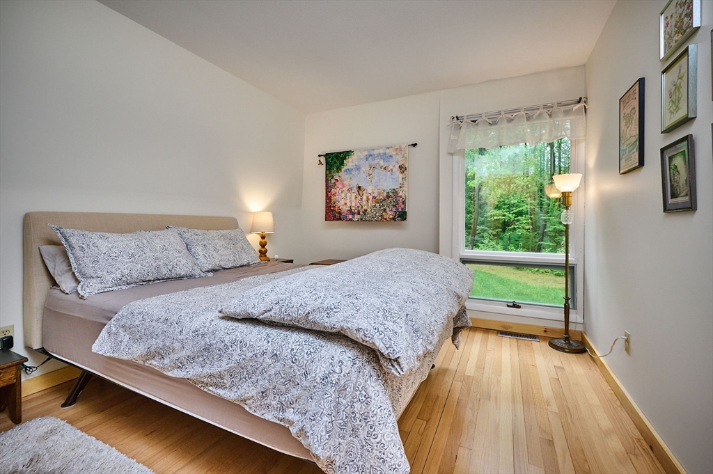 88 High Point Drive Amherst, MA 01002 - Photo 23 of 35 a bed sitting in a bedroom next to a window
