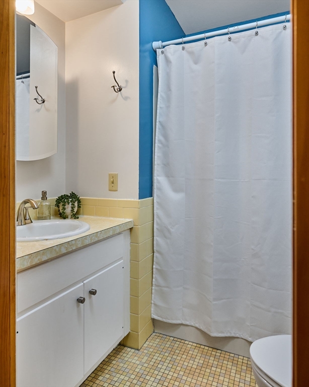 88 High Point Drive Amherst, MA 01002 - Photo 25 of 35 a bathroom with a granite countertop sink and a mirror