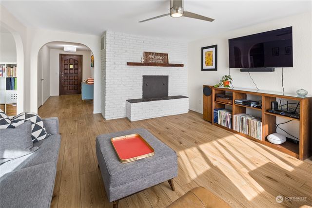 a living room with furniture and a flat screen tv