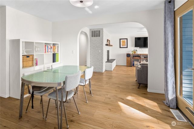 a view of a livingroom with furniture and a window