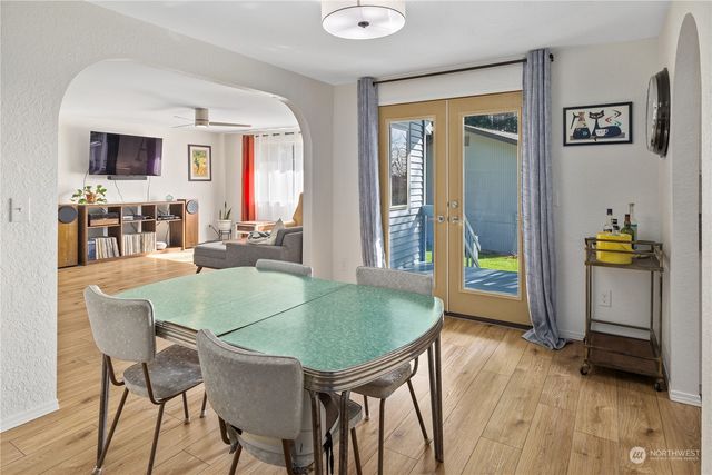 a dining room with furniture and window