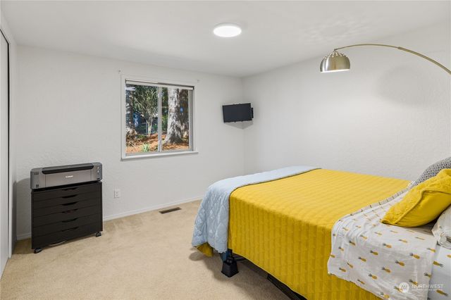 a bedroom with a bed and a cabinets