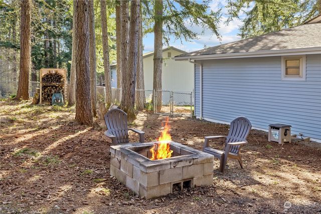 a backyard of a house with outdoor seating
