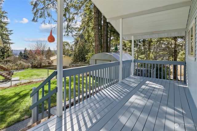 a view of balcony with wooden floor