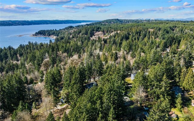 an aerial view of a houses with a yard