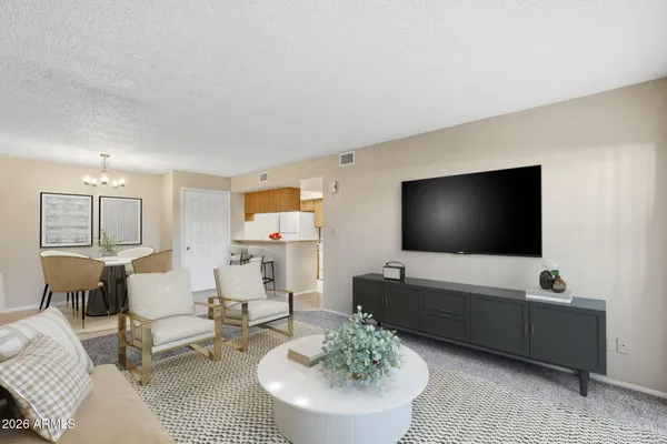 a living room with furniture and a flat screen tv