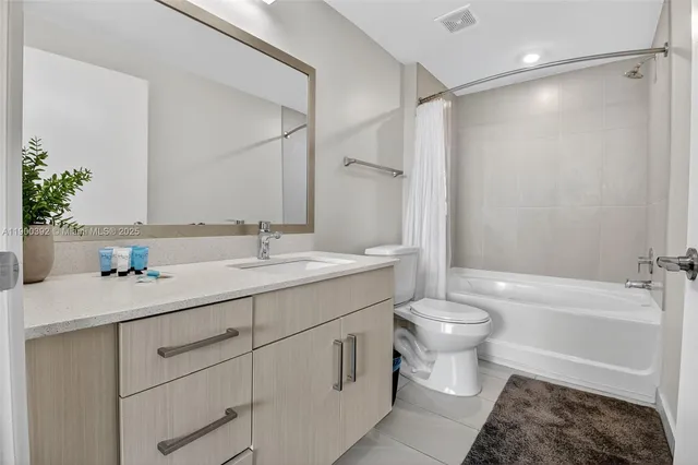 a bathroom with a toilet sink and a bathtub