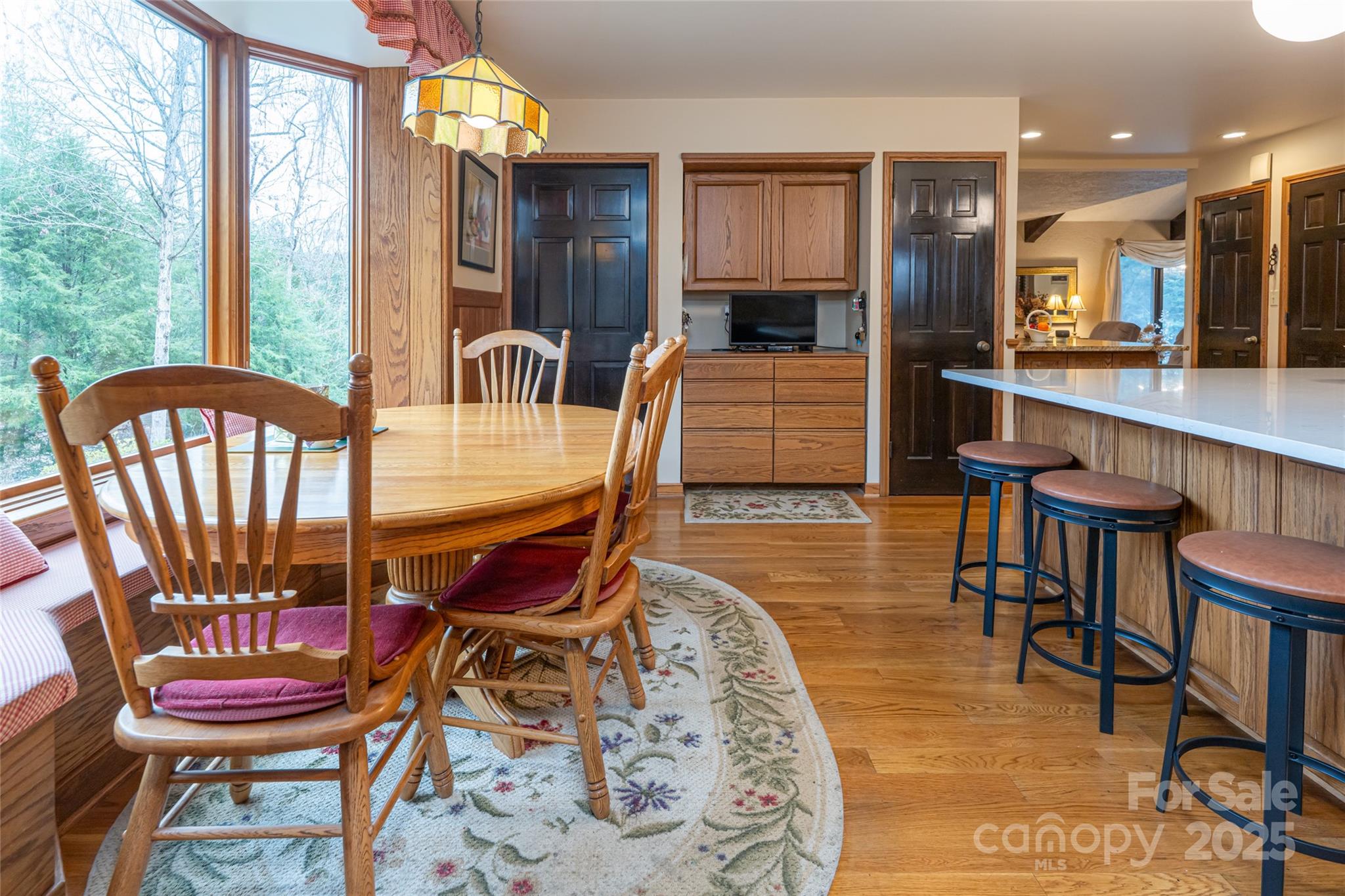 69 Forest Road Asheville, NC 28803 - Photo 12 of 48 a dining room with furniture and wooden floor