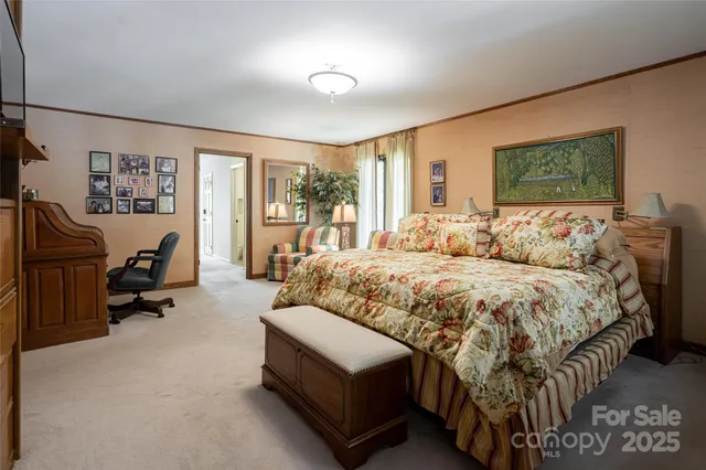 a bedroom with a bed and ceiling fan