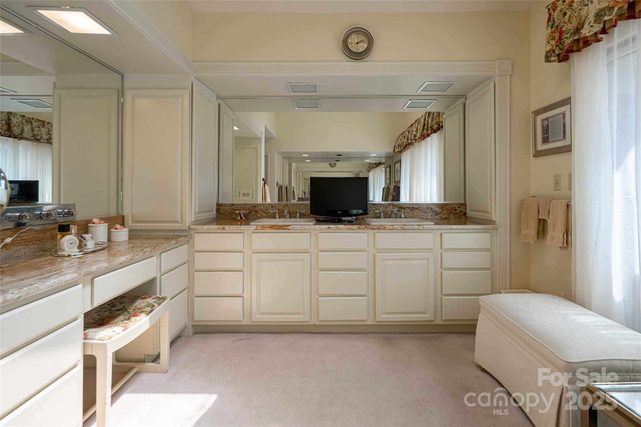 69 Forest Road Asheville, NC 28803 - Photo 19 of 48 a spacious bathroom with a granite countertop sink mirror and toilet