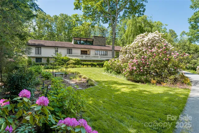 a living room with fireplace furniture and a flat screen tv