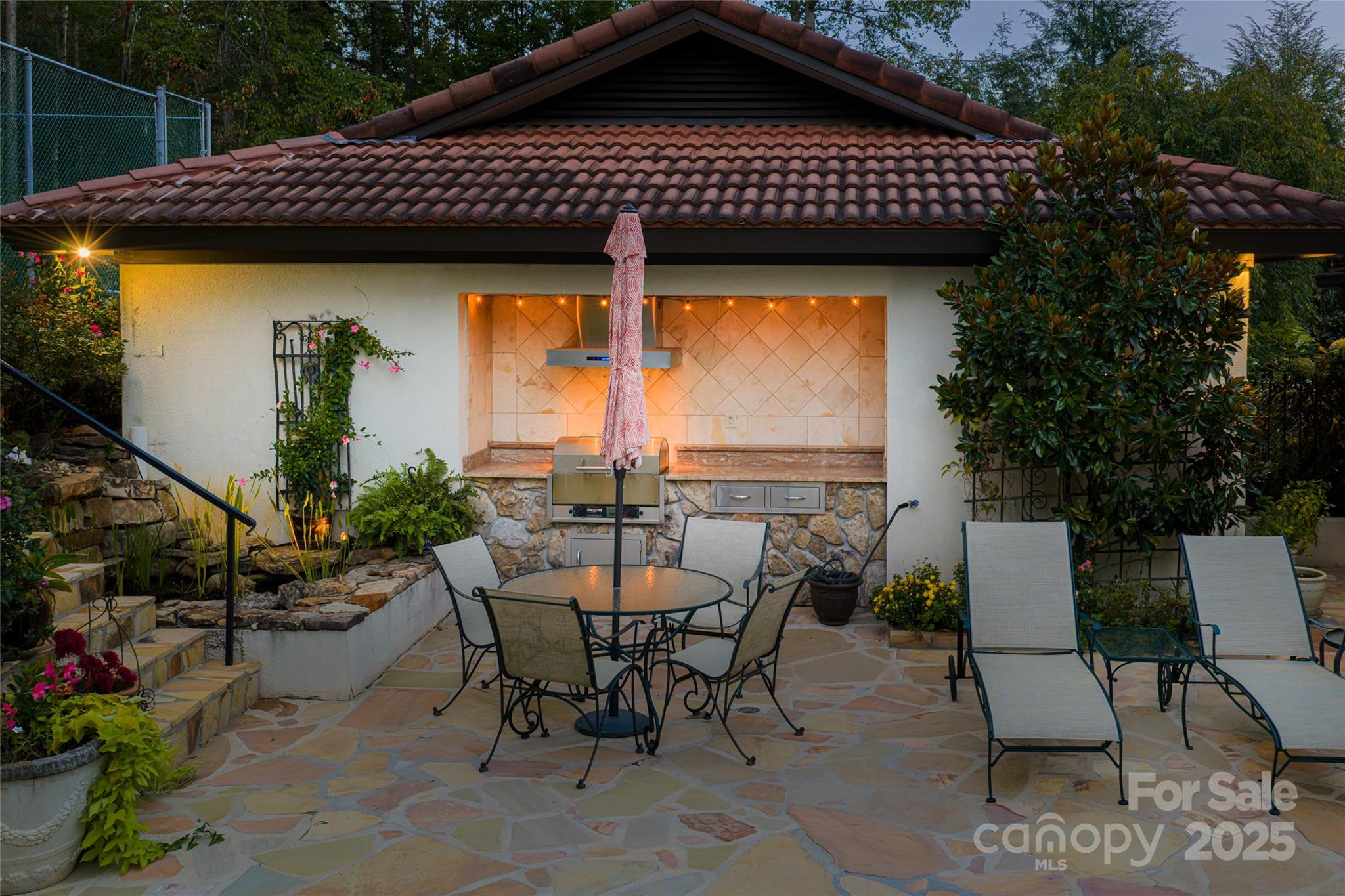 69 Forest Road Asheville, NC 28803 - Photo 47 of 48 a view of a tables and chairs in patio