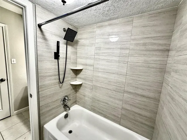 a bathroom with a sink and shower