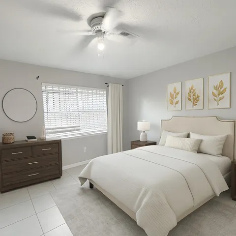 a bedroom with a bed and a dresser