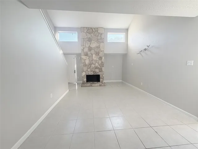 a view of an empty room with windows