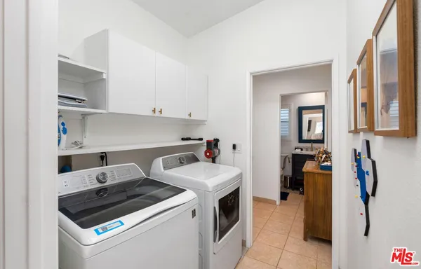 a view of storage and utility room with washer and dryer