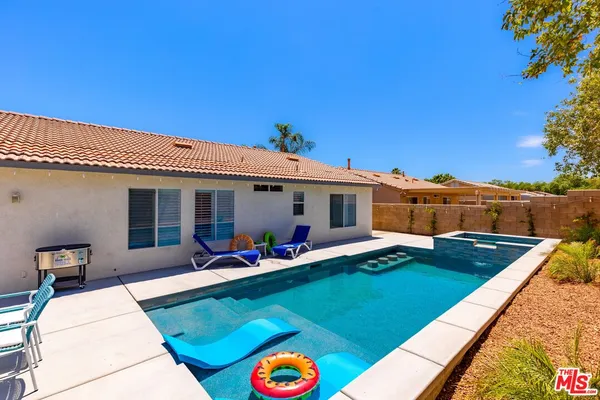 a front view of house with outdoor seating