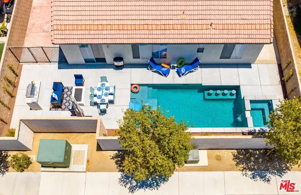 a view of swimming pool with a outdoor seating