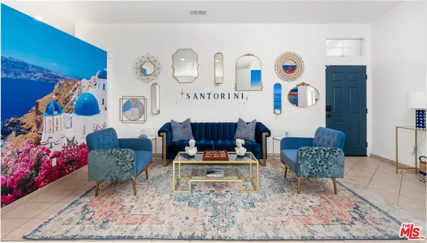 a living room with furniture and a table