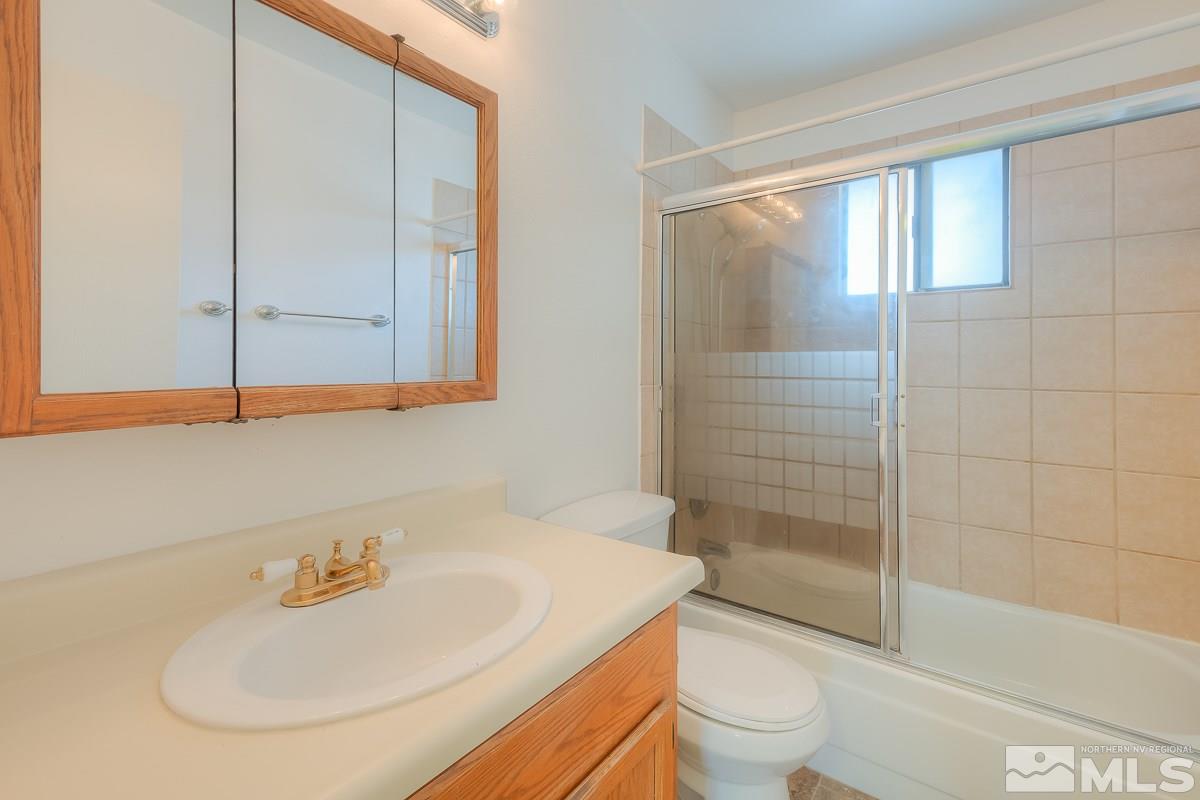 4985 West 7th Street, Unit 6 Reno, NV 89503 - Photo 13 of 15 a bathroom with a sink a toilet and shower
