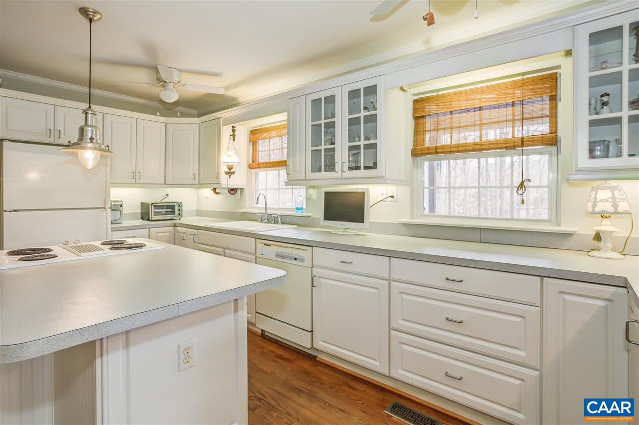 9 East Point Road Palmyra, VA 22963 - Photo 8 of 38 a kitchen with cabinets appliances a sink and a window