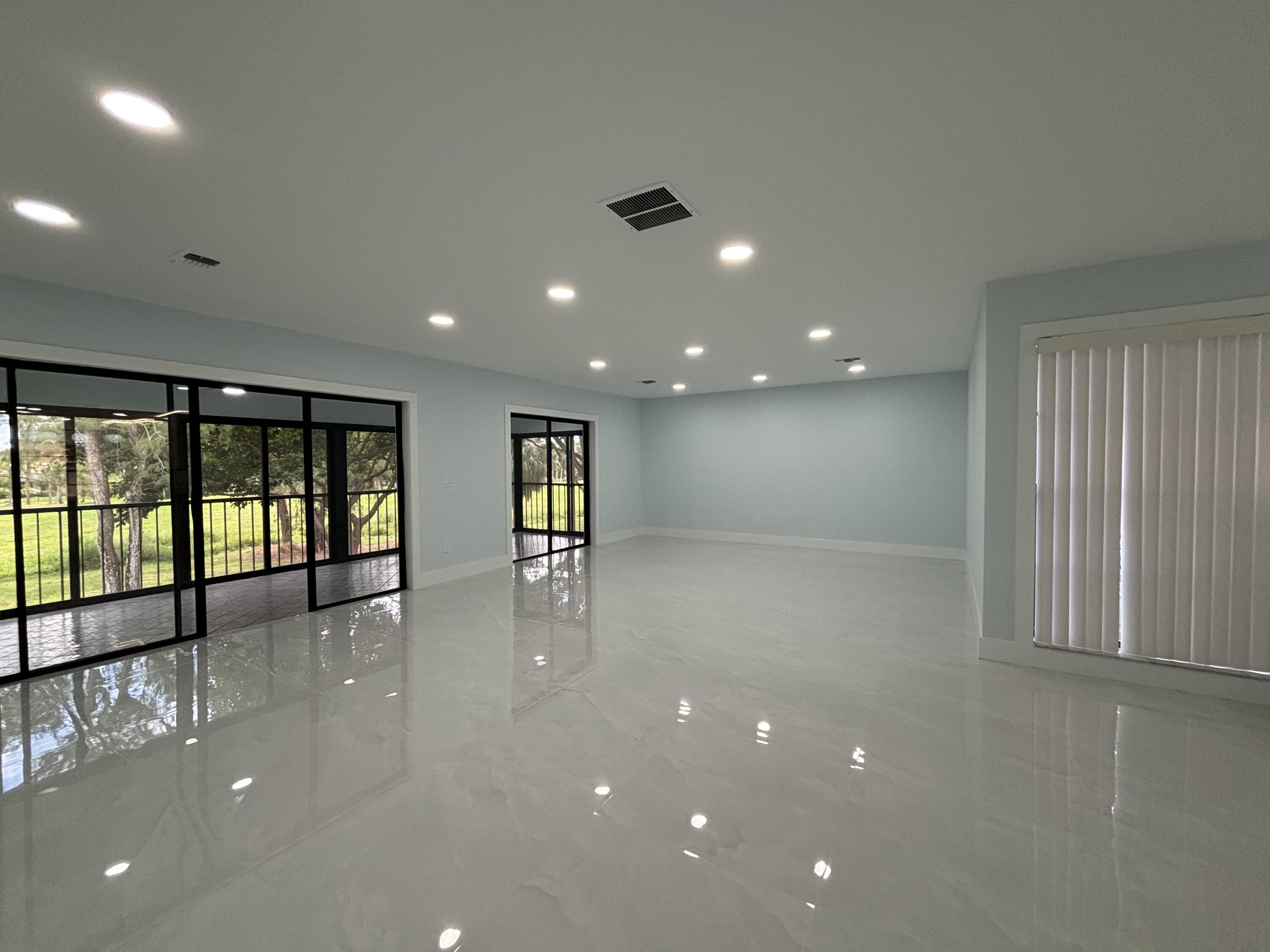 a view of an empty room with windows