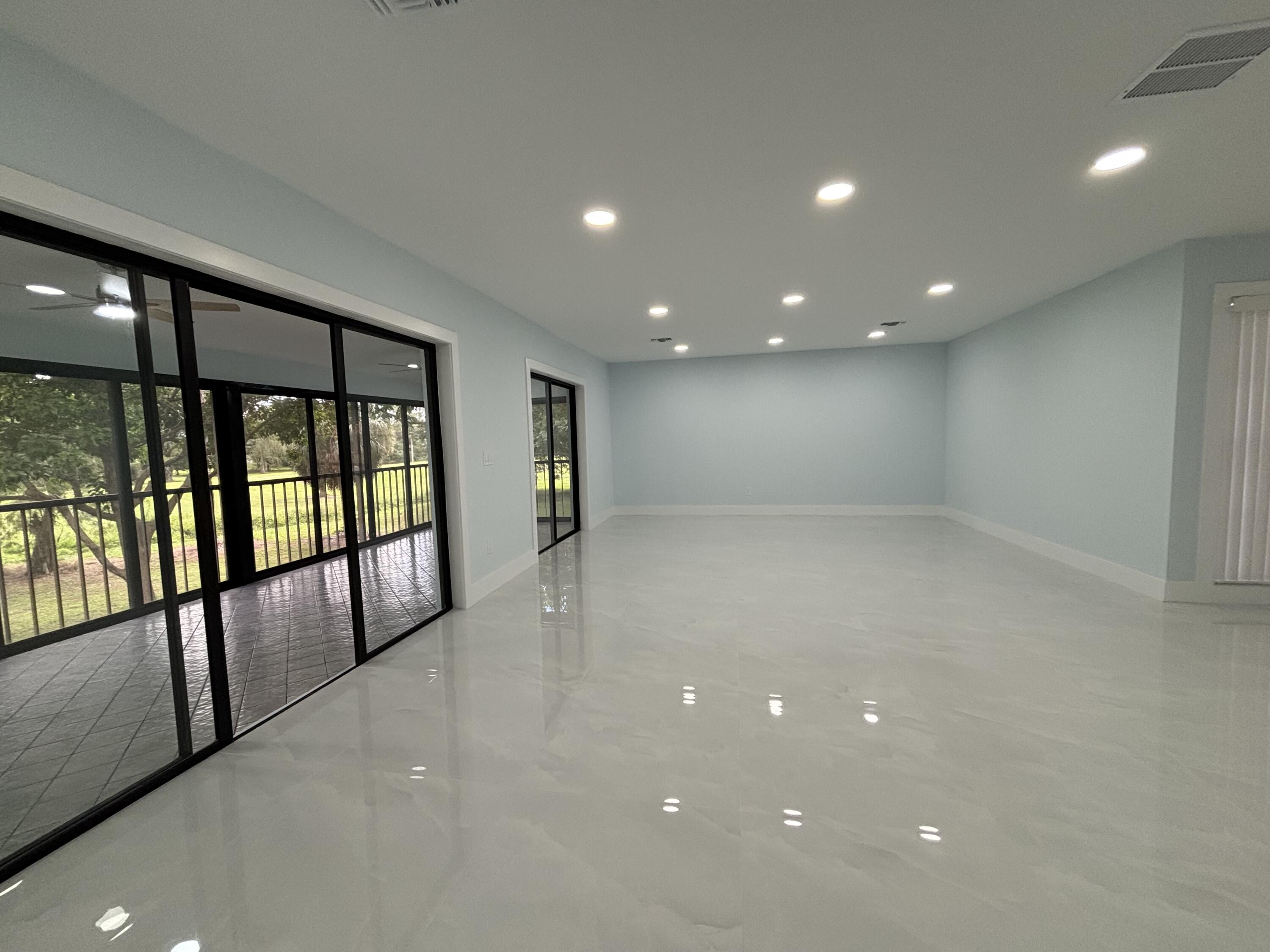9266 Vista Del Lago, Unit 25H Boca Raton, FL 33428 - Photo 14 of 38 a view of an empty room with windows