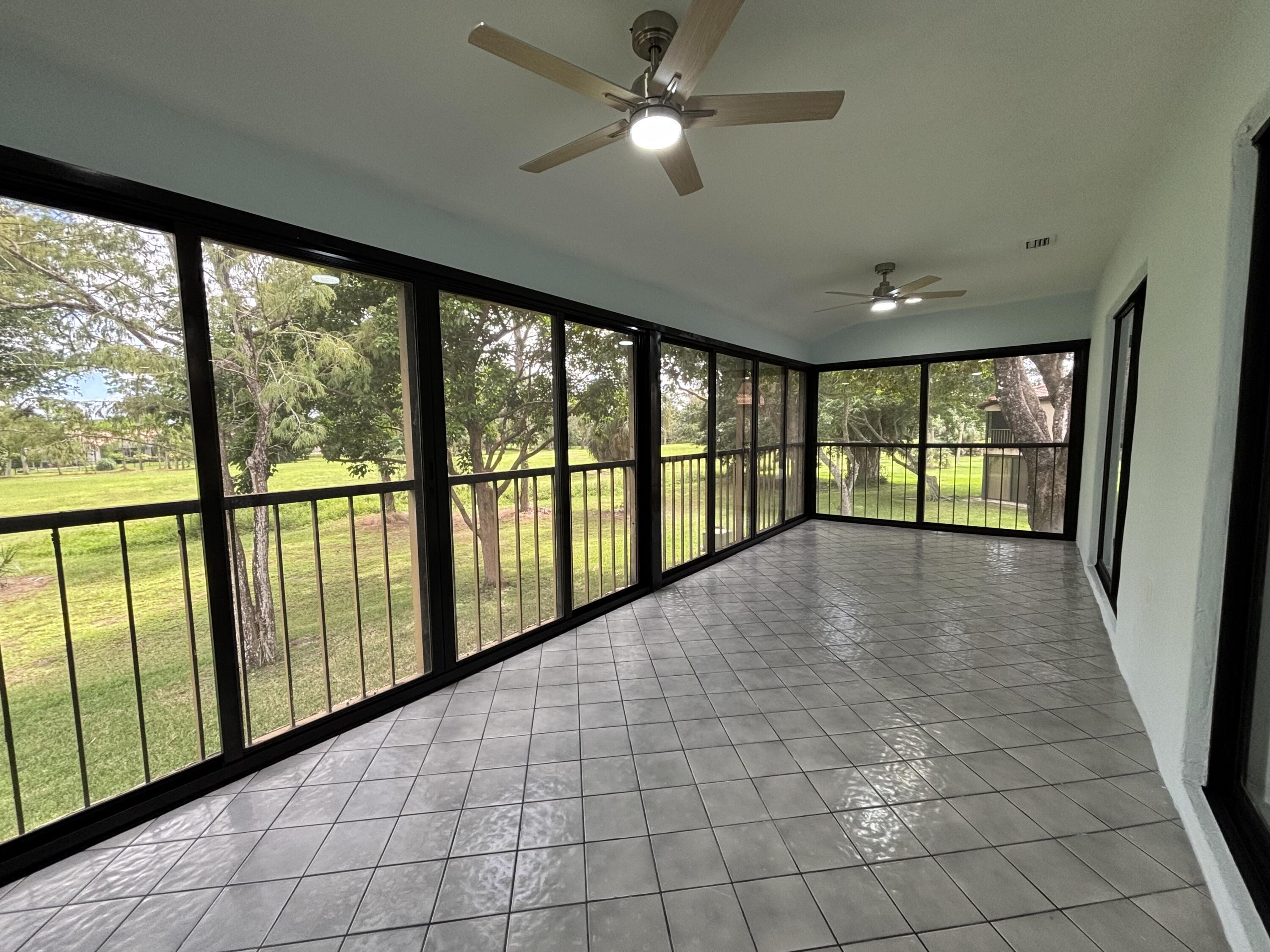 9266 Vista Del Lago, Unit 25H Boca Raton, FL 33428 - Photo 16 of 38 a view of hallway with windows