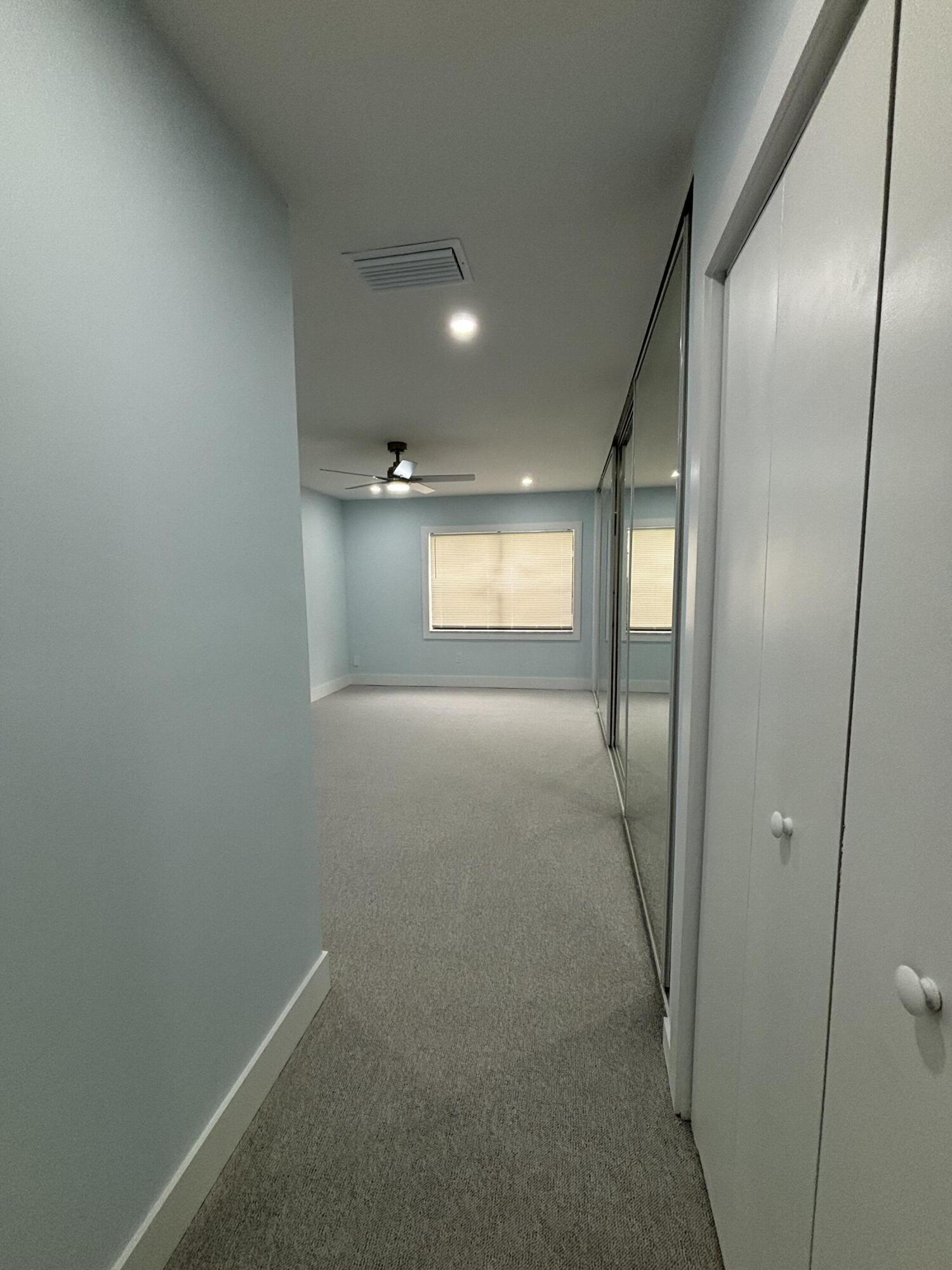 9266 Vista Del Lago, Unit 25H Boca Raton, FL 33428 - Photo 19 of 38 a view of hallway with windows