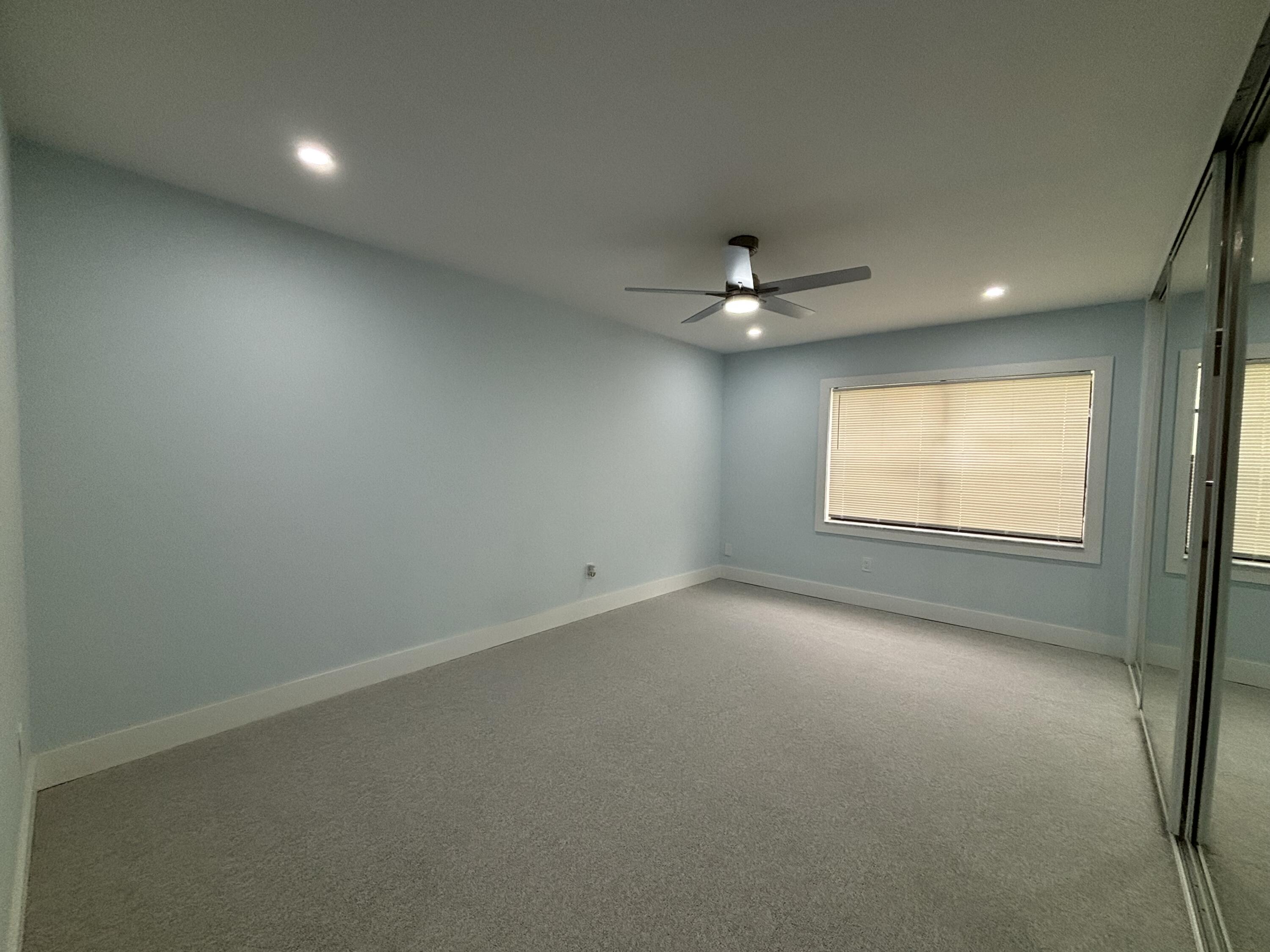 9266 Vista Del Lago, Unit 25H Boca Raton, FL 33428 - Photo 20 of 38 an empty room with a window and a fan