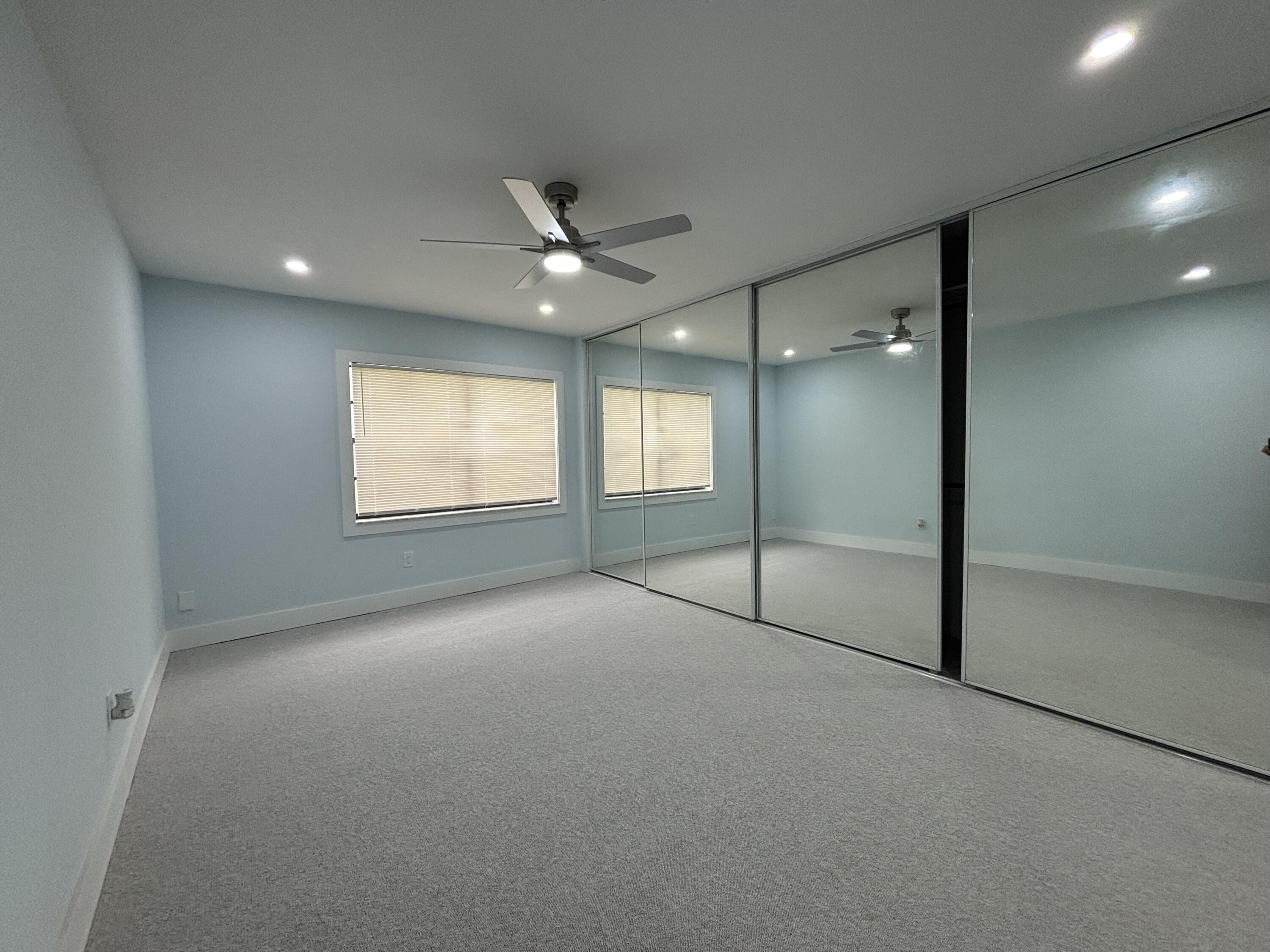 9266 Vista Del Lago, Unit 25H Boca Raton, FL 33428 - Photo 22 of 38 a view of an empty room with a window