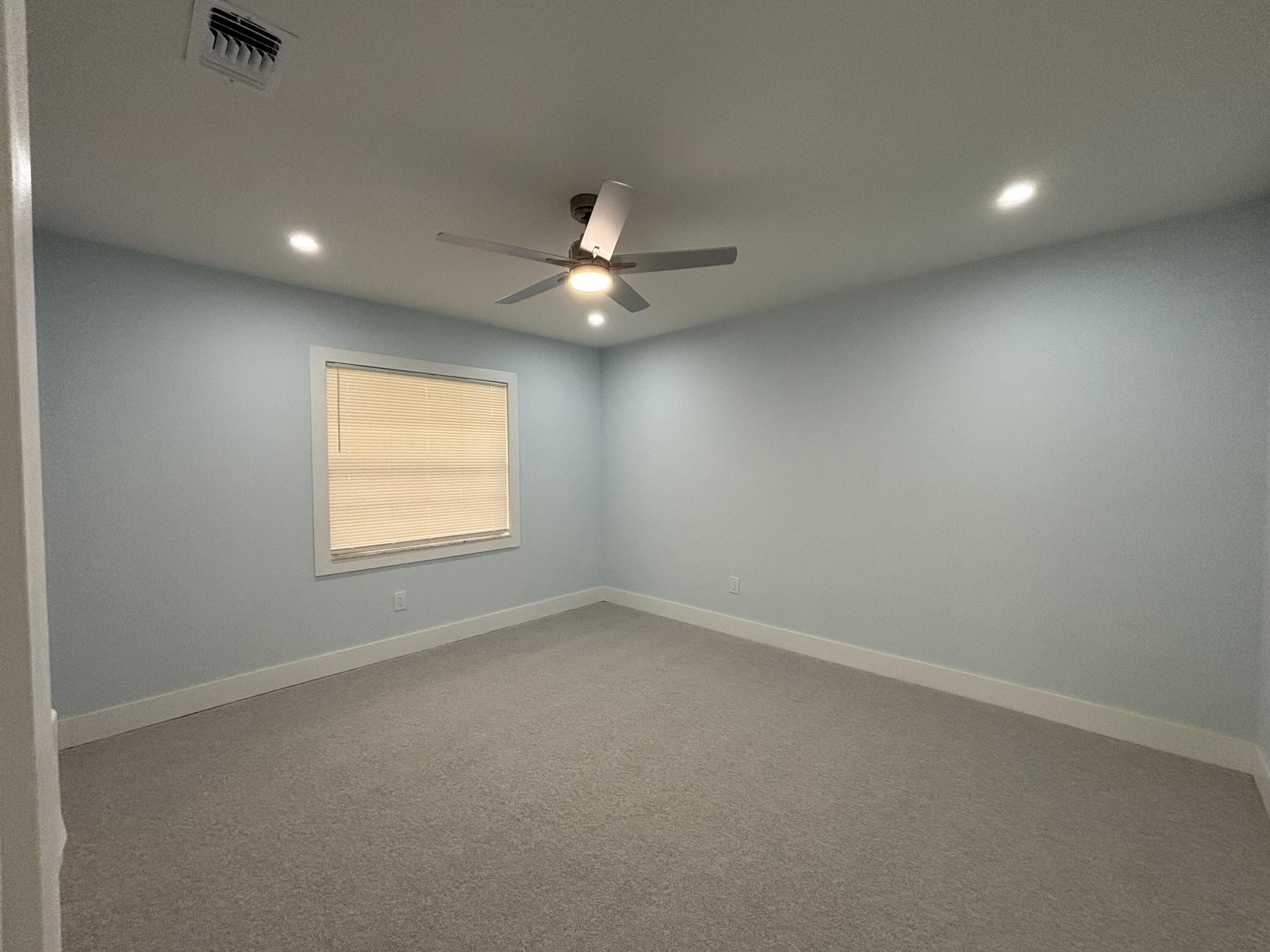 9266 Vista Del Lago, Unit 25H Boca Raton, FL 33428 - Photo 30 of 38 an empty room with a window and a fan