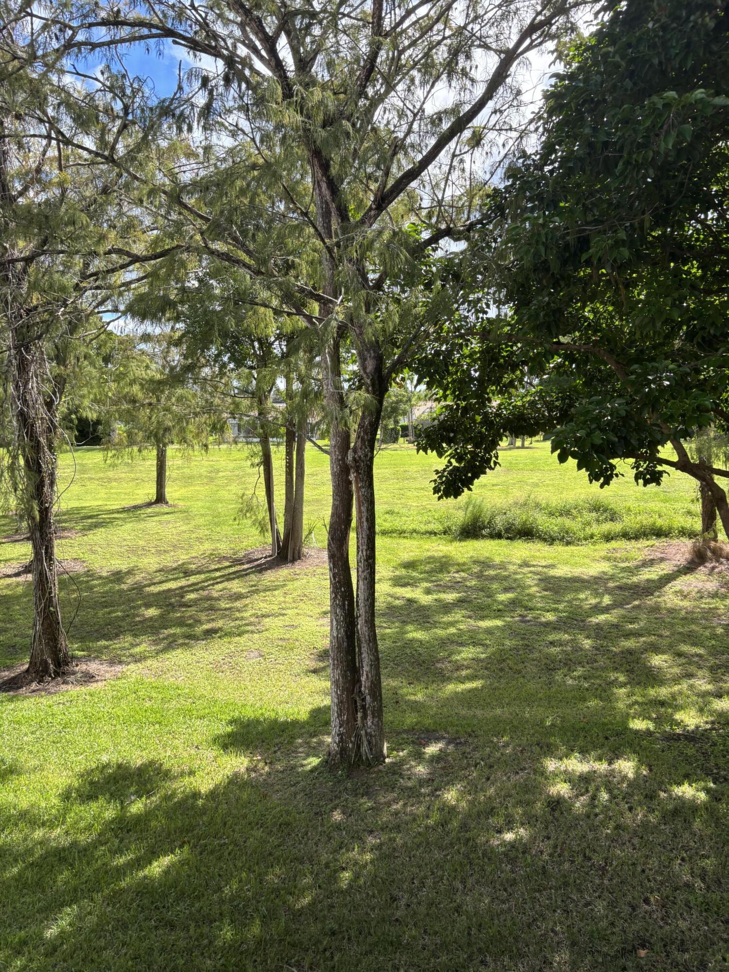 9266 Vista Del Lago, Unit 25H Boca Raton, FL 33428 - Photo 35 of 38 a view of an ocean from a yard